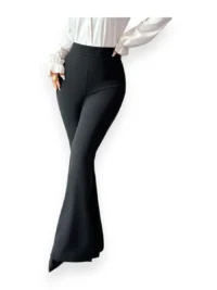 Woman wearing black wide leg flare pants crossing legs, elegant look.