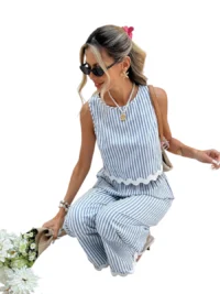 Close-up of blue striped sleeveless top with scalloped hem detail.